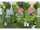 Aerial shot of waterfront homes with screened pools, private docks, and lush landscaping along the serene water at 220 39Th Ne St, Bradenton, FL 34208