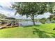 Picture-perfect backyard with a private dock, mature trees, and waterfront views at 220 39Th Ne St, Bradenton, FL 34208