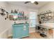 Stylish bar area with open shelving, vintage cabinet, and a stainless steel workstation at 220 39Th Ne St, Bradenton, FL 34208