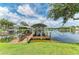 Lakeside home featuring a private boat dock, perfect for boating and water activities at 220 39Th Ne St, Bradenton, FL 34208