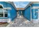 Inviting entryway with a white front door and an outdoor seating area, creating a warm welcome at 220 39Th Ne St, Bradenton, FL 34208