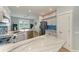Spacious kitchen with a marble island, stainless appliances, and a view into the dining and living spaces at 220 39Th Ne St, Bradenton, FL 34208