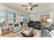 Bright living room boasts hardwood floors, ceiling fan, and an open layout to the kitchen, perfect for entertaining at 220 39Th Ne St, Bradenton, FL 34208