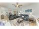 Bright living room boasts hardwood floors, ceiling fan, and an open layout to the kitchen, perfect for entertaining at 220 39Th Ne St, Bradenton, FL 34208