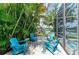 Enjoy outdoor living with comfortable seating, lush landscaping, and a screened-in lanai at 220 39Th Ne St, Bradenton, FL 34208