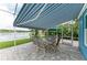 Covered patio with seating area and lake views at 220 39Th Ne St, Bradenton, FL 34208