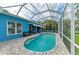 Beautiful pool surrounded by a screened-in lanai with a lake view at 220 39Th Ne St, Bradenton, FL 34208