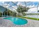 Beautiful pool area within a screened enclosure, offering a scenic lake view at 220 39Th Ne St, Bradenton, FL 34208