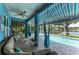 Relaxing screened-in lanai with a pool, hammocks and outdoor seating with a view of the canal at 220 39Th Ne St, Bradenton, FL 34208