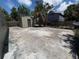Spacious backyard with large concrete pad, outbuilding, and chain link fence at 2629 14Th S Ave, St Petersburg, FL 33712