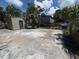 This backyard has a large concrete pad, an outbuilding, and a chain link fence at 2629 14Th S Ave, St Petersburg, FL 33712