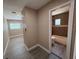 Hallway view of a bathroom with a tub, toilet, and neutral wall color at 2629 14Th S Ave, St Petersburg, FL 33712