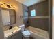 Bathroom view featuring gray vanity with mirror, and tiled tub/shower combo at 2629 14Th S Ave, St Petersburg, FL 33712