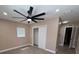 Neutral-toned bedroom with fan, closet, and wood-look flooring for a comfortable space at 2629 14Th S Ave, St Petersburg, FL 33712