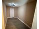 Small bedroom with luxury vinyl plank flooring and a modern light fixture at 2629 14Th S Ave, St Petersburg, FL 33712