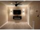 Modern living room featuring an electric fireplace, ceiling fan, and neutral wall color at 2629 14Th S Ave, St Petersburg, FL 33712