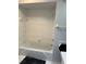 Clean bathroom with white tile, a bathtub and a shower at 3262 Brunswick Ln # 707, Sarasota, FL 34239