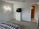 Bedroom featuring a dresser and doorway at 3262 Brunswick Ln # 707, Sarasota, FL 34239