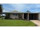 Charming single-story home with a well-manicured lawn, mature landscaping and convenient covered parking at 3262 Brunswick Ln # 707, Sarasota, FL 34239