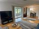 Spacious living room with access to a screened in patio and a dining area for easy entertaining at 3262 Brunswick Ln # 707, Sarasota, FL 34239
