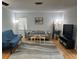 Inviting living room with neutral paint, sleek furniture, and stylish accents at 3262 Brunswick Ln # 707, Sarasota, FL 34239