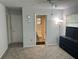 Bedroom with a doorway to the bathroom at 3262 Brunswick Ln # 707, Sarasota, FL 34239