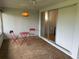 Sunroom featuring decorative chairs and a view of the indoors at 3262 Brunswick Ln # 707, Sarasota, FL 34239
