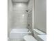 Modern bathroom showcasing a tiled shower-tub combination and a contemporary toilet with a sleek vanity at 3512 Cross Creek Pkwy, Parrish, FL 34219