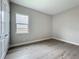 Cozy bedroom with hardwood floors, featuring a window that provides natural light, and neutral walls for versatile decor at 3512 Cross Creek Pkwy, Parrish, FL 34219