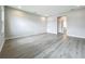 Neutral bedroom with hardwood floors, featuring a window that provides natural light, and neutral walls for versatile decor at 3512 Cross Creek Pkwy, Parrish, FL 34219