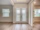 Bright foyer features wood floors, neutral paint colors, and direct access to other areas of the home at 3512 Cross Creek Pkwy, Parrish, FL 34219