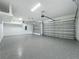 Spacious three-car garage with epoxy flooring and automatic door openers at 3512 Cross Creek Pkwy, Parrish, FL 34219