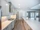 Modern kitchen featuring stainless steel appliances, a large island, and access to other living spaces at 3512 Cross Creek Pkwy, Parrish, FL 34219