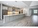 Modern kitchen features a large island, stainless steel appliances, and sleek cabinetry at 3512 Cross Creek Pkwy, Parrish, FL 34219