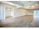 Spacious, open concept living room features wood floors, recessed lighting, and neutral paint colors at 3512 Cross Creek Pkwy, Parrish, FL 34219