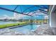Enjoy this screened-in pool with calming water views, a serene escape for relaxation and enjoyment at 3512 Cross Creek Pkwy, Parrish, FL 34219
