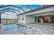 Enjoy this spacious screened-in pool with water views, perfect for outdoor entertainment and relaxation at 3512 Cross Creek Pkwy, Parrish, FL 34219