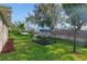 A spacious and well-kept backyard featuring a dark patio set and sturdy fencing at 3524 Brownwood Ter, North Port, FL 34286