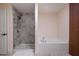 Bathroom showcases a walk-in shower and a separate soaking tub with sleek modern fixtures at 3524 Brownwood Ter, North Port, FL 34286