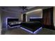 Contemporary bedroom featuring two beds with illuminated accents and stylish design at 3524 Brownwood Ter, North Port, FL 34286