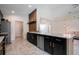Well-equipped kitchen with dark cabinets, stainless steel appliances, and sleek countertops, perfect for cooking at 3524 Brownwood Ter, North Port, FL 34286