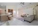 Spacious living area featuring vaulted ceilings, modern decor, and seamless flow to the kitchen at 3524 Brownwood Ter, North Port, FL 34286