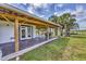 Enjoy the outdoors on the covered patio with views of the grounds at 39700 State Road 70 E, Myakka City, FL 34251