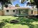 Spacious backyard view with a screened-in porch at 4112 Cochise Ter, Sarasota, FL 34233