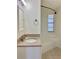 Bathroom featuring a granite vanity, mirror, and shower with tub at 4112 Cochise Ter, Sarasota, FL 34233
