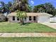 Charming single-story home with a well-manicured lawn and lush tropical landscaping in a desirable neighborhood at 4112 Cochise Ter, Sarasota, FL 34233