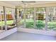 Enclosed sunroom with multiple windows offering backyard views at 4112 Cochise Ter, Sarasota, FL 34233
