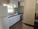 A well-lit kitchen with a refrigerator and plenty of cabinet space at 4122 N Lockwood Ridge Rd, Sarasota, FL 34234