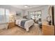 Light and airy bedroom with a ceiling fan and a sliding glass door to a screened porch at 4153 66Th Street W Cir # 4153, Bradenton, FL 34209