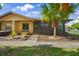 Charming home exterior featuring beautiful landscaping and a sidewalk to the front door at 4153 66Th Street W Cir # 4153, Bradenton, FL 34209